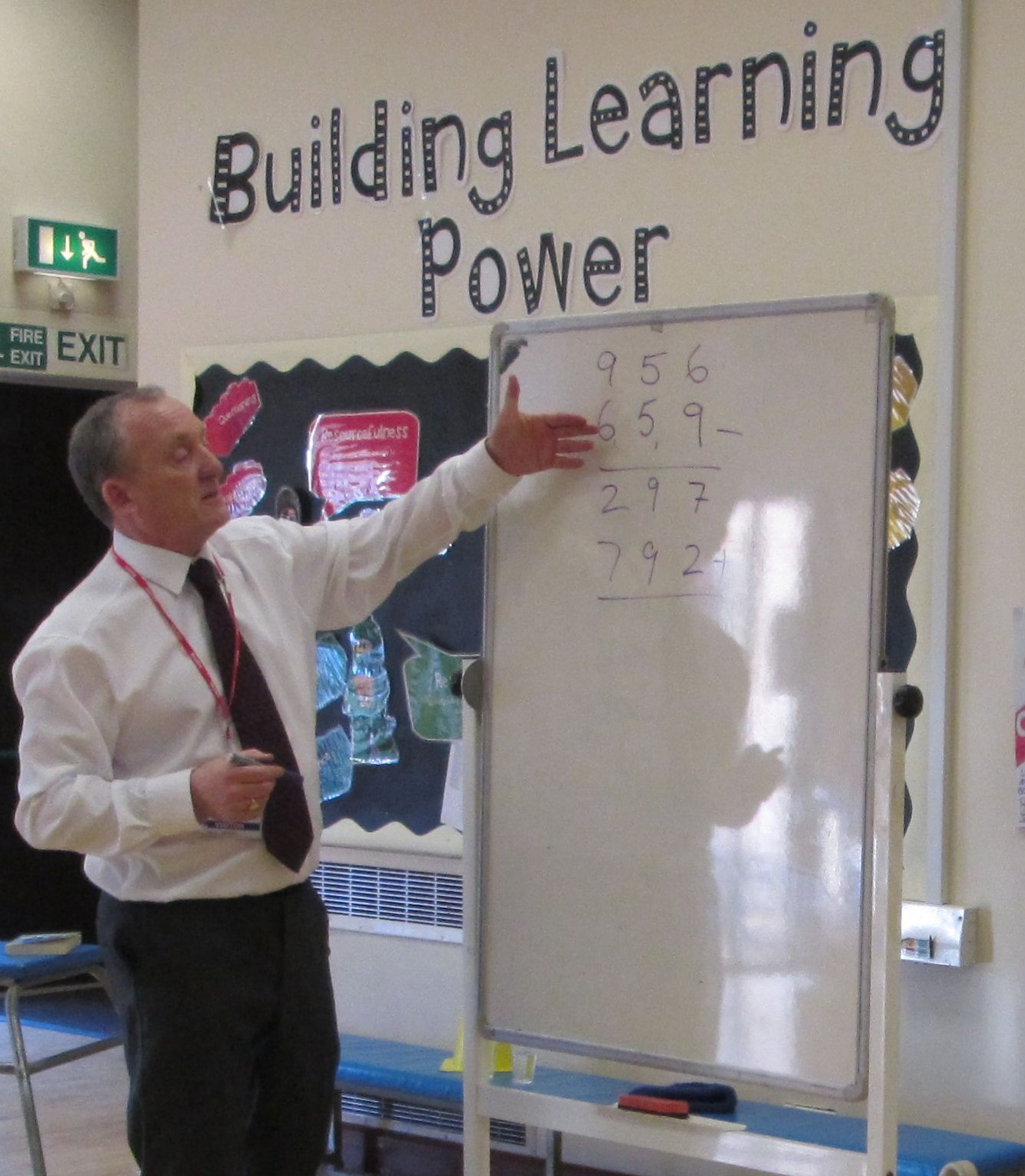Ron demonstrating a rapid addition method on a flip chart