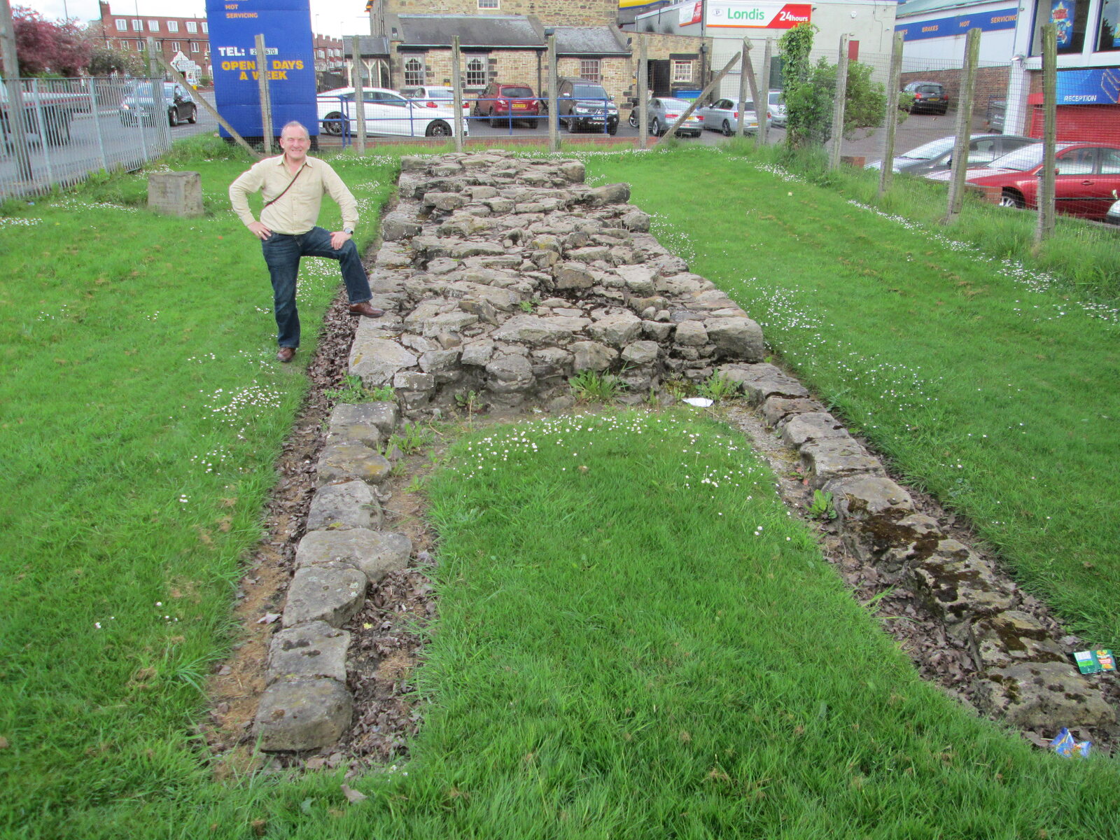 Ron Wood beside exposed remains of Hadrian’s Wall in Newcastle
