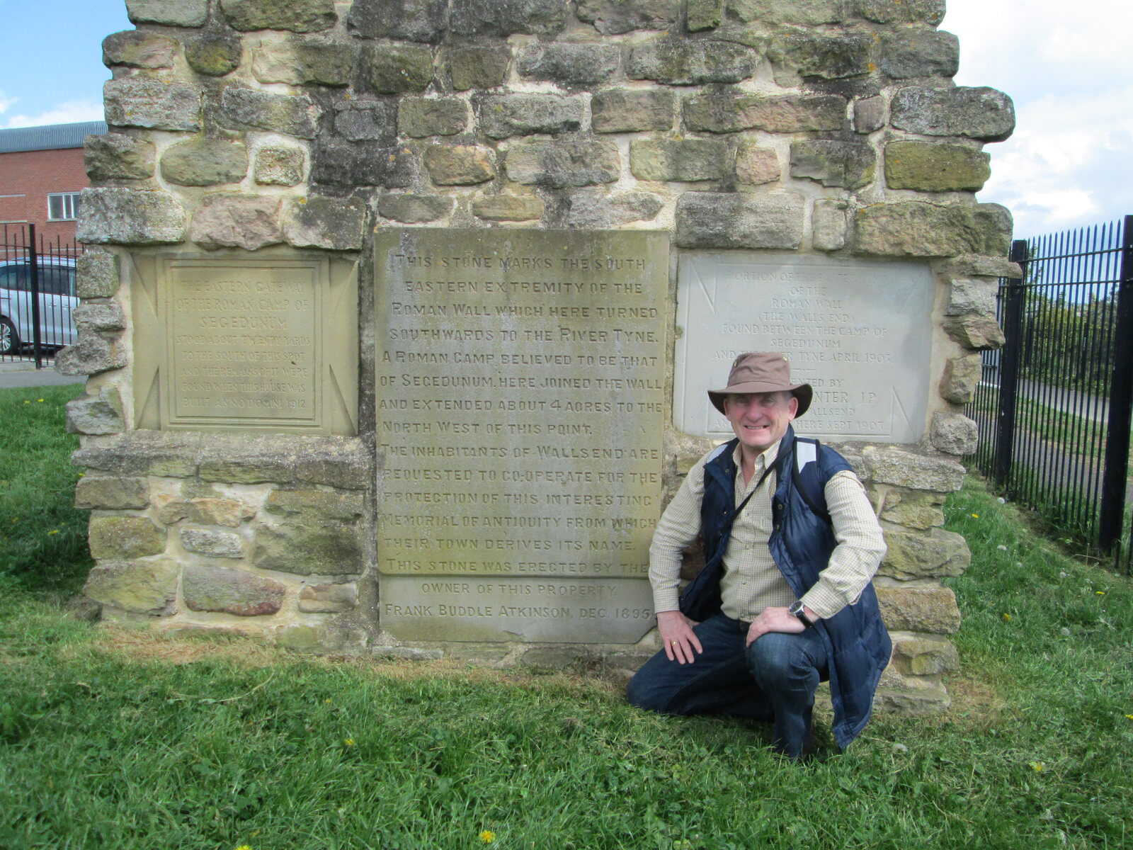 Ron Wood beside a Roman inscription at Wallsend