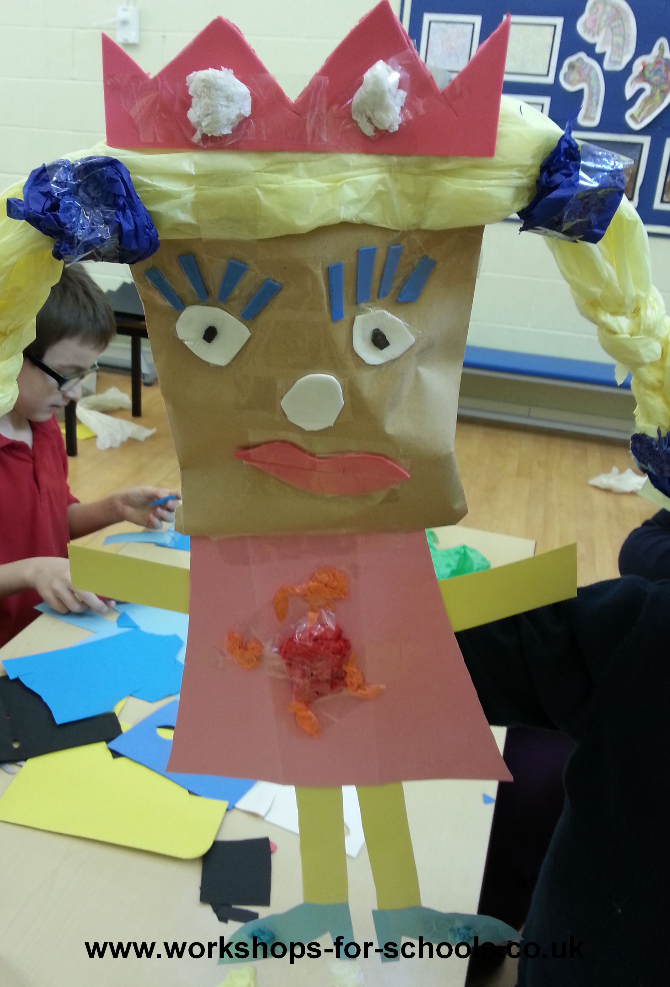 Children showing the colourful puppets they created