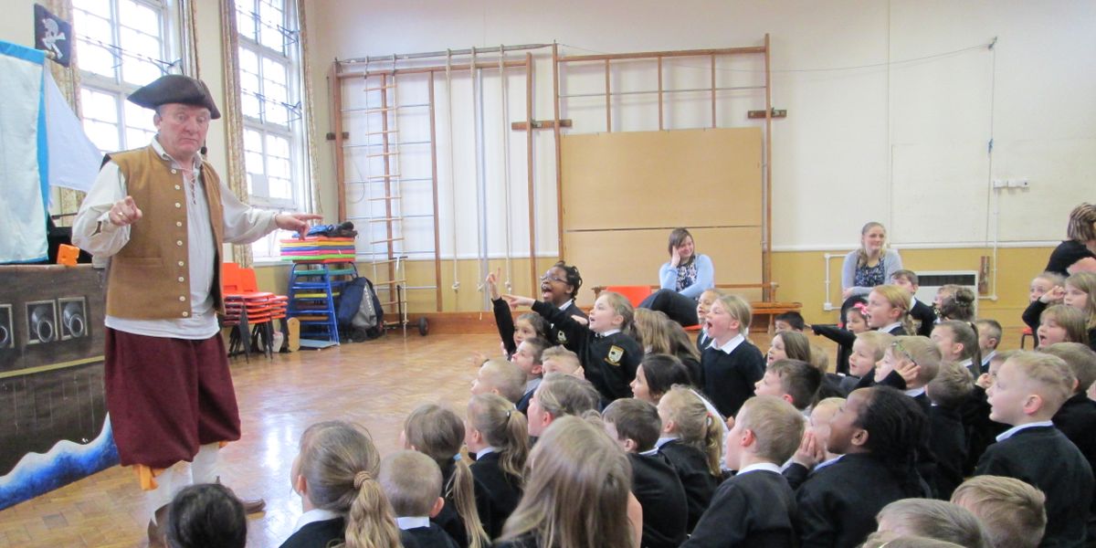 Pirate Ron entertaining an enthusiastic group of primary school children