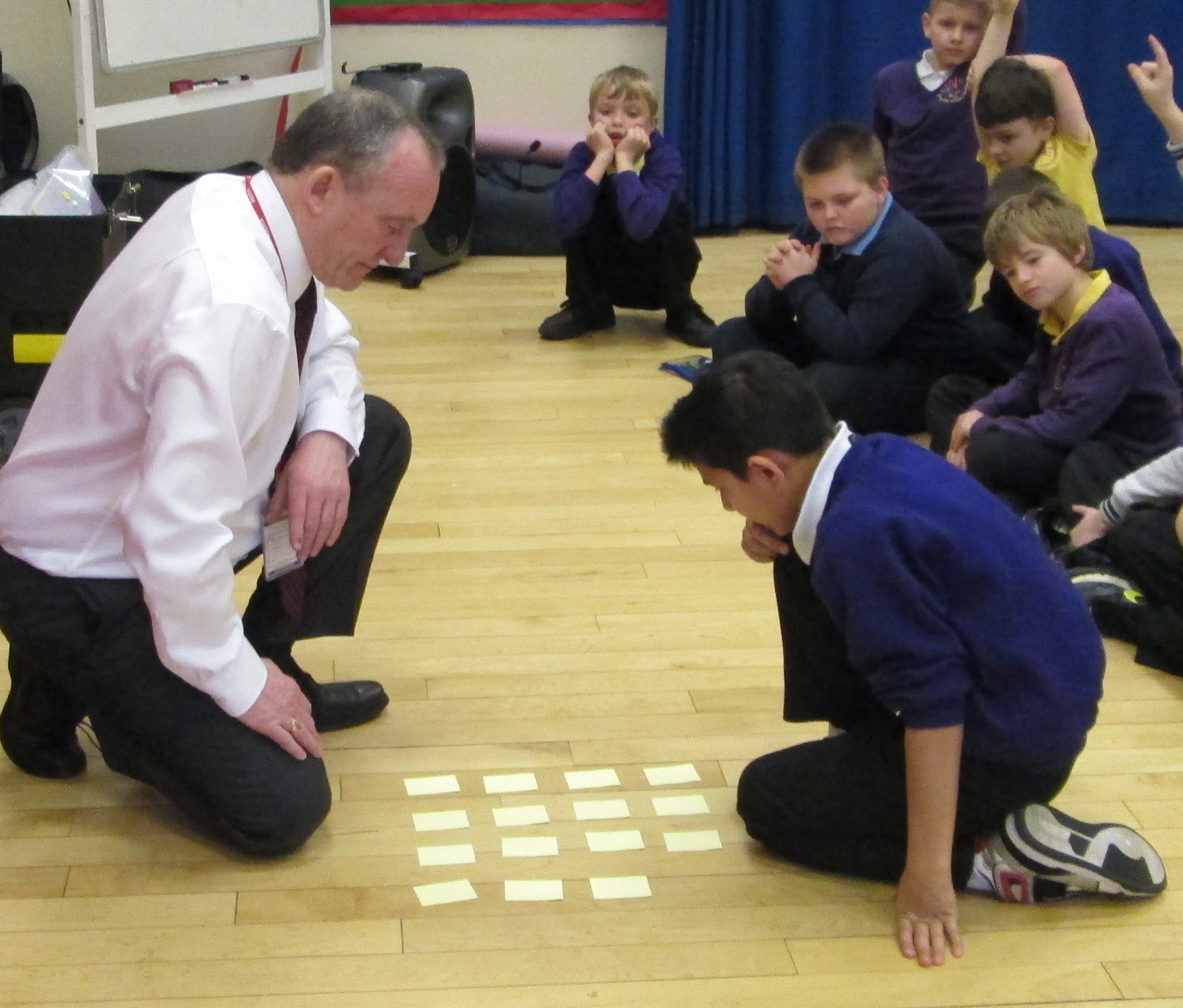 Ron demonstrating a rapid mental maths calculation to a group of children