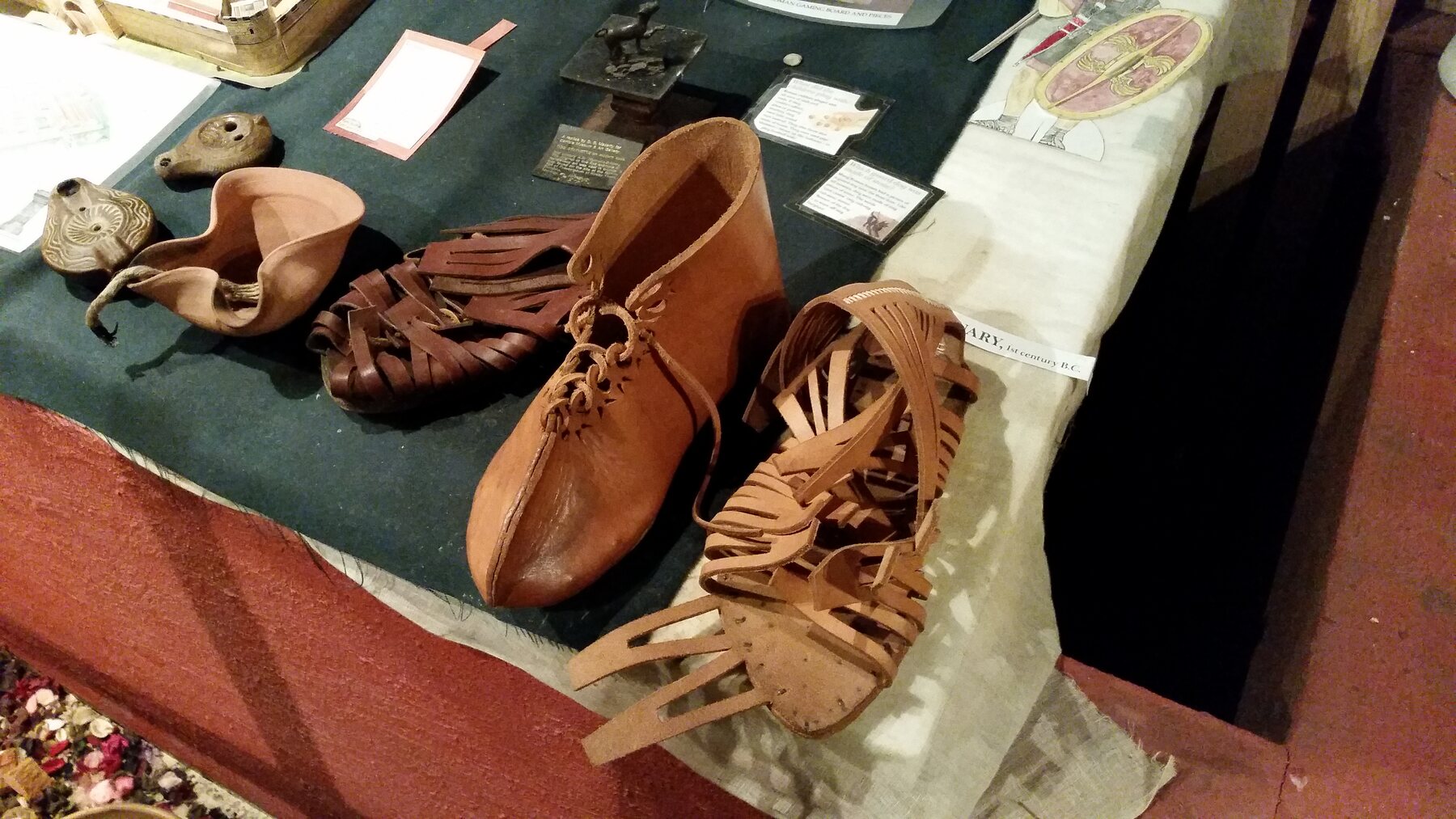 Reconstructed Roman footwear and objects on display