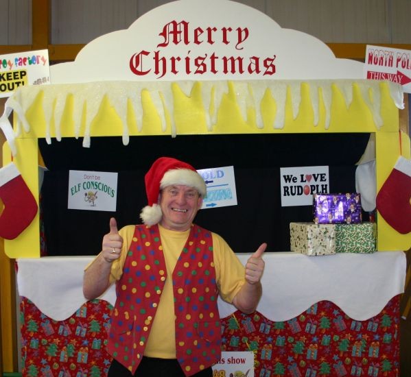 A colourful xmas themed puppet theatre ready for a school performance